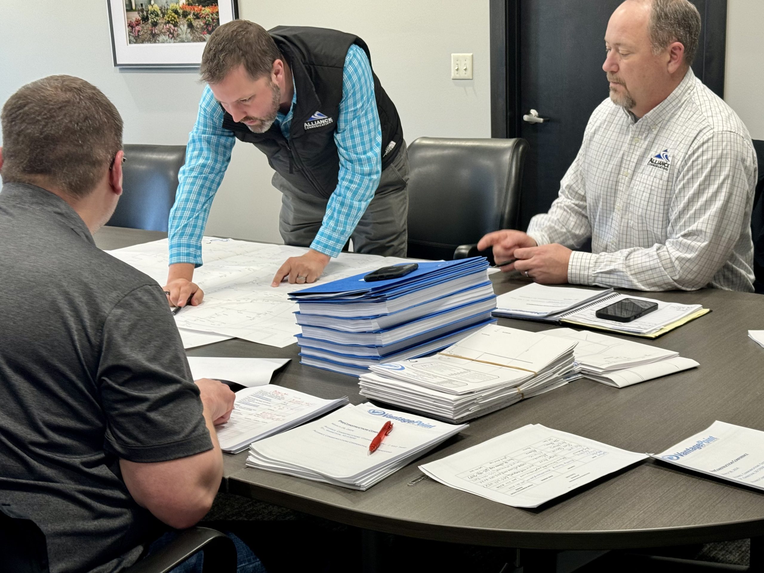 Alliance CEO Ross Petrick and COO Andy Hulscher review construction maps for rural Beresford's new fiber network.