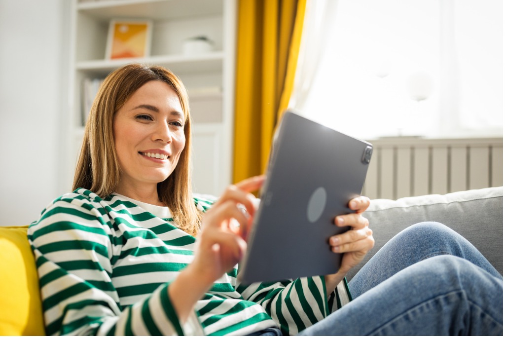 Woman using discounted internet service thanks to the federal Lifeline program, which provides up to a $9.25/month discount for eligible low-income consumers on selected services.